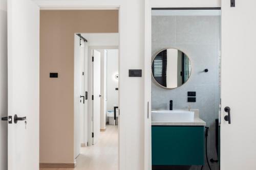 a bathroom with a sink and a mirror at 5BR Modern Luxury Pool Villa Patong TPSV140 in Patong Beach