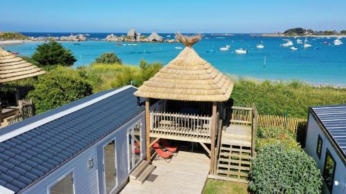 a gazebo with a view of the water at Camping de la côte des légendes in Brignogan-Plages
