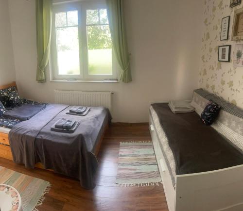 Posteľ alebo postele v izbe v ubytovaní Rozmaring Vendégház