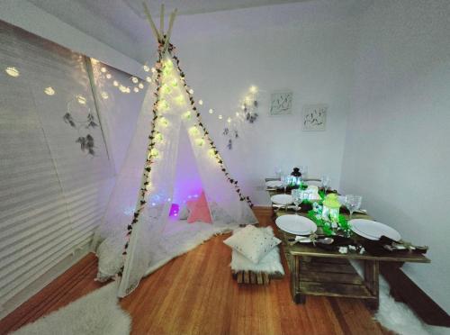 a room with a dining table and a tent at Private Cozy and Spacious 2br Home with TeePee Dining Room! Private Parking! Self Check-in in Burnaby