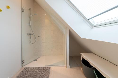 a bathroom with a shower in a attic at Les Palissades - La mer du bon côté in Saint-Pierre-Quiberon