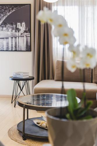 a living room with a couch and a table at Harmony Apartments in Podgorica