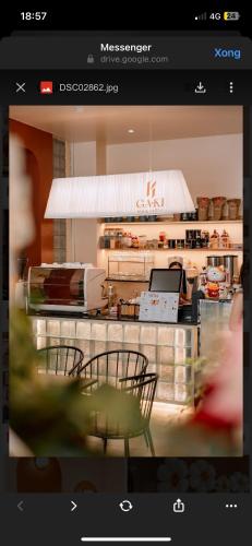 a picture of a restaurant with chairs and a counter at Gaki Hotel in Hue