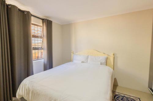 Ένα ή περισσότερα κρεβάτια σε δωμάτιο στο Durban Italian villa 3