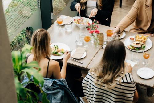 a group of people sitting at a table eating food at GamlaVærket Gjæstgiveri og Tracteringssted in Sandnes