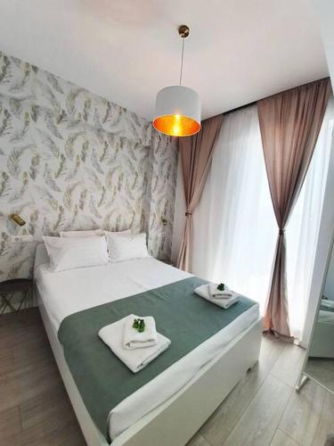 Giường trong phòng chung tại Oasis Beach Apartment