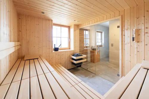 a large room with a glass door in a building at Chalet Tannenhaus I in Maltaberg