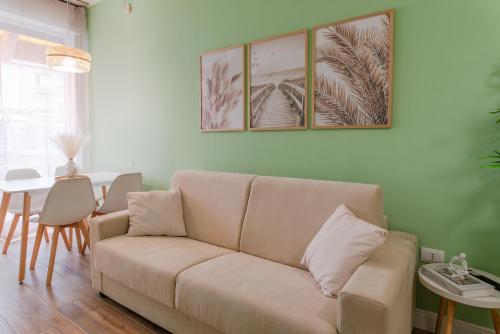 a living room with a couch and a table at Valentino Apartment by Toh Solution in Turin