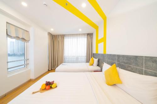 Katil atau katil-katil dalam bilik di Happy Day Riverside Hotel & Spa Danang