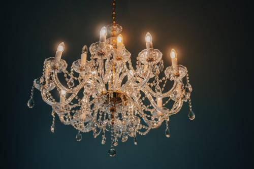 a chandelier hanging from a ceiling at GamlaVærket Gjæstgiveri og Tracteringssted in Sandnes