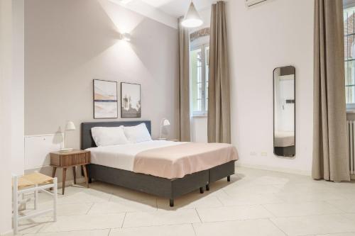 Ένα ή περισσότερα κρεβάτια σε δωμάτιο στο Limehome Verona La Vigna in Città