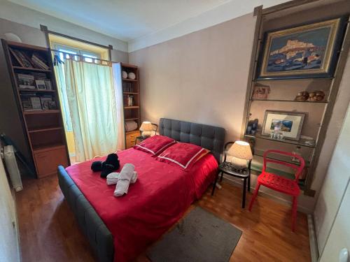 a bedroom with a red bed and a red blanket at Room near Nice Port in a shared apartment in Nice