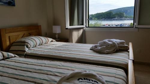 Кровать или кровати в номере Alipa Beach Apartment