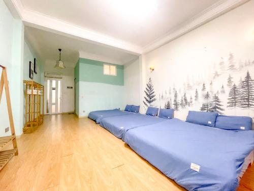 Postel nebo postele na pokoji v ubytování Xenia Đà Lạt 2