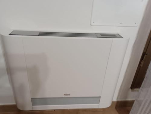 a white stove top oven sitting in a room at A casa di Elena e Francesco in Bernalda