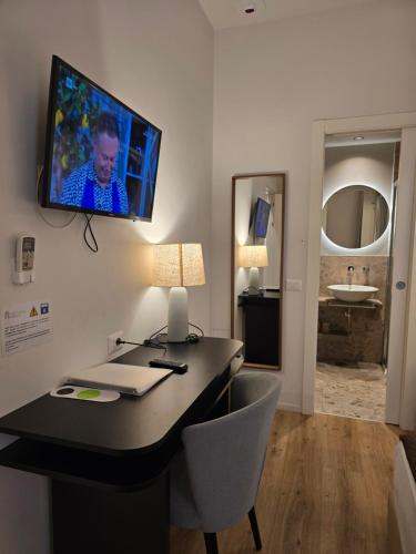TV a/nebo společenská místnost v ubytování Hotel Porta Pia