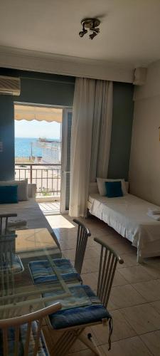 Postel nebo postele na pokoji v ubytování Seaside Studios
