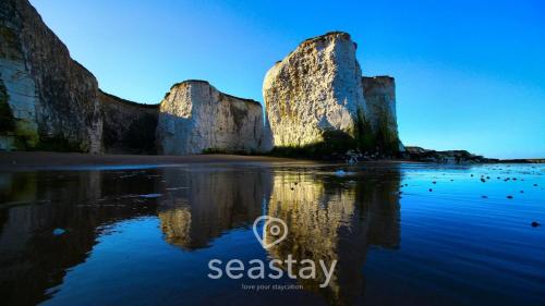 a view of two large rocks in the water at Aurora Spa Seaview Penthouse Ramsgate in Kent