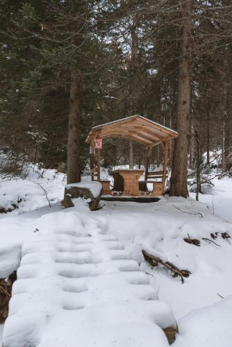 a gazebo in the woods in the snow at Casa Montana in Kopaonik