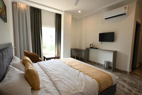 Postel nebo postele na pokoji v ubytování Tarang Stay Inn