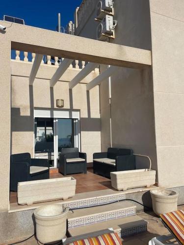 a model of a patio with chairs and tables at Villa Del Sol in Alicante