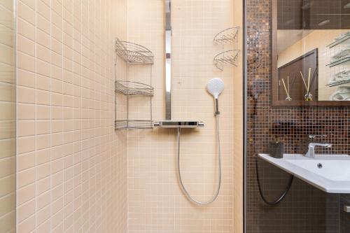a bathroom with a shower and a sink at Pirita Beach Studio with Parking in Tallinn
