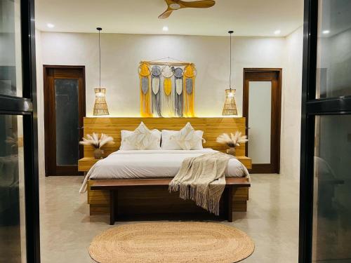 a bedroom with a large bed in a room at Lio Villas Resort in El Nido