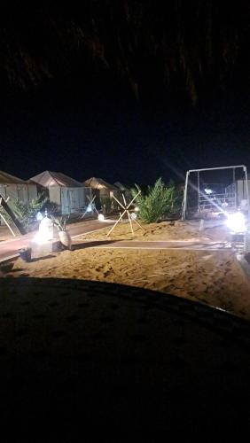a group of lights on a soccer field at night at Berber Merzouga Luxury Camp in Merzouga