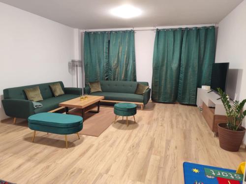 a living room with a couch and a table at Franco Piešťany Apartments 2 in Piešťany