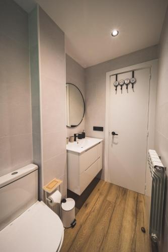 a bathroom with a white toilet and a sink at Piso Andorra Arinsal in Arinsal