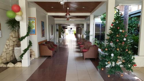 a hallway with a christmas tree in a building at Hexagon International Hotel, Villas & Spa in Nadi