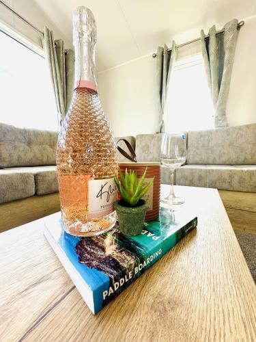 a bottle of wine sitting on top of a book at Moor Crest in Scarborough