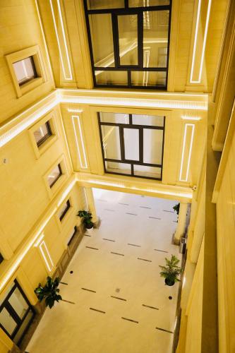 an overhead view of a ceiling with windows and plants at RIO Hotel in Samarkand