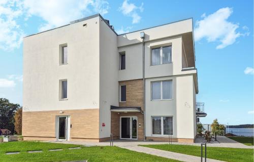 an image of a white building at Beautiful Apartment In Insko With Sauna in Ińsko
