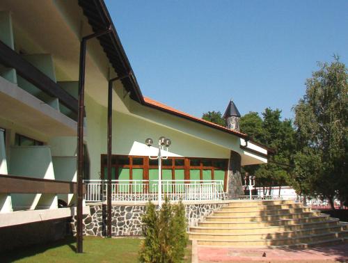 a building with a staircase and a building with a tower at Hotel Genesis in Vratsa