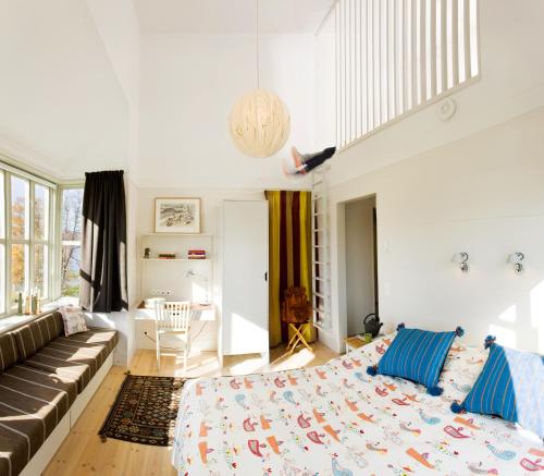 Ένα ή περισσότερα κρεβάτια σε δωμάτιο στο Fjällnäs Est 1882