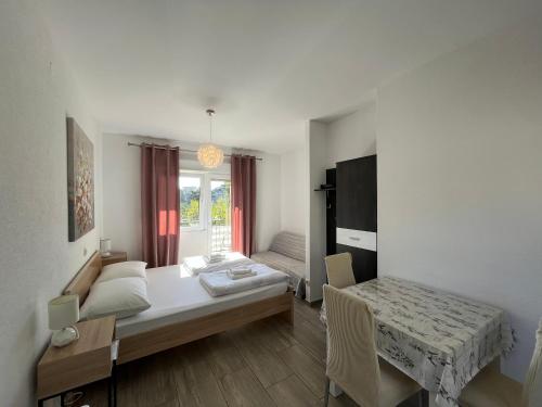 Postel nebo postele na pokoji v ubytování Apartmani Lisičina