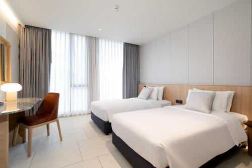 Ένα ή περισσότερα κρεβάτια σε δωμάτιο στο Saan Hotel Sathorn