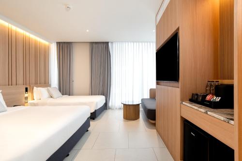 Ένα ή περισσότερα κρεβάτια σε δωμάτιο στο Saan Hotel Sathorn