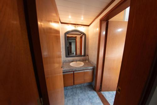 a bathroom with a sink and a mirror at Casa Elvira in Piriápolis