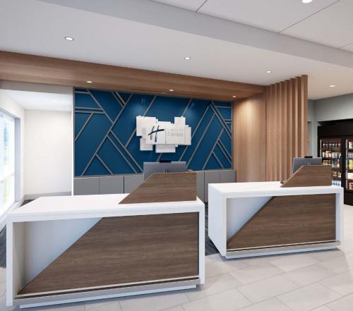 an office with two desks and a wall with a mural at Holiday Inn Express & Suites Oklahoma City Northwest by IHG in Oklahoma City