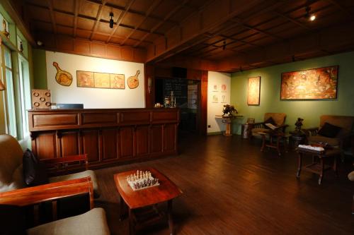 a living room with a court room at Blackberry Hills Munnar Nature Resort & Spa in Munnar