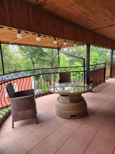 a patio with a table and chairs on a balcony at Noclegi Gracja in Wałbrzych