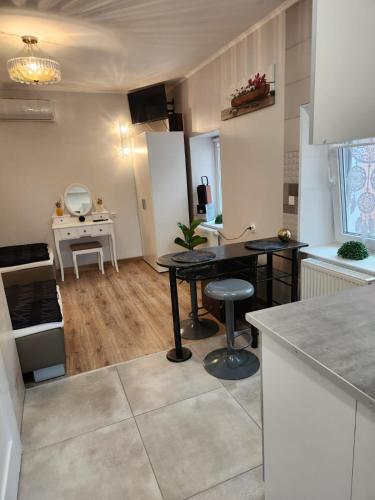 a kitchen with a table and a counter top at Noclegi Gracja in Wałbrzych