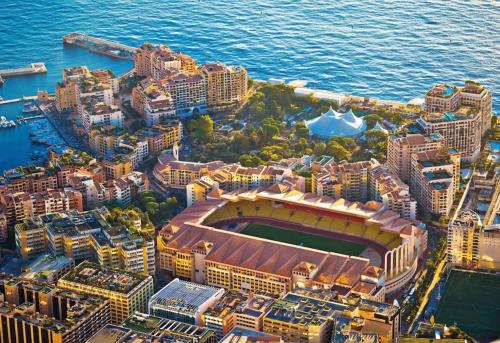 an aerial view of a city with a baseball stadium at Très bel appartement à Monaco in Fontvieille