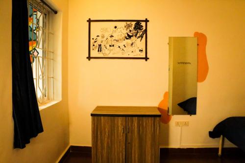 a room with a wooden cabinet and a window at Summer Hostel in Palolem