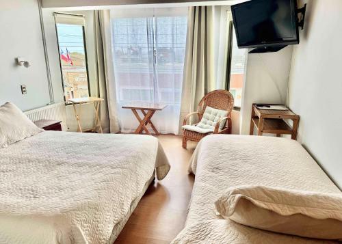 Ein Bett oder Betten in einem Zimmer der Unterkunft Hotel Montecarlo Pichilemu