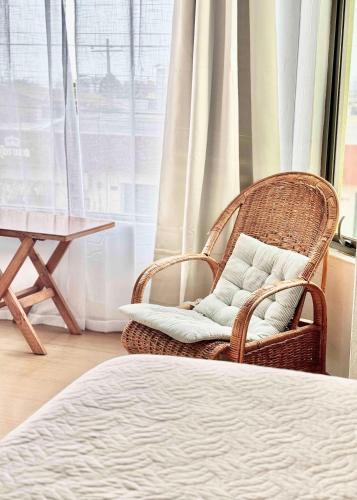 Ein Bett oder Betten in einem Zimmer der Unterkunft Hotel Montecarlo Pichilemu