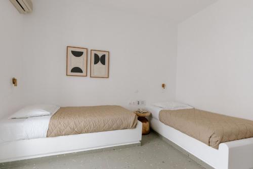 Cama o camas de una habitación en Pnoi Hotel