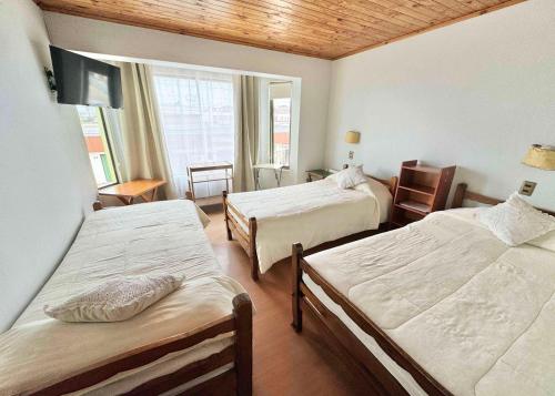 Ein Bett oder Betten in einem Zimmer der Unterkunft Hotel Montecarlo Pichilemu